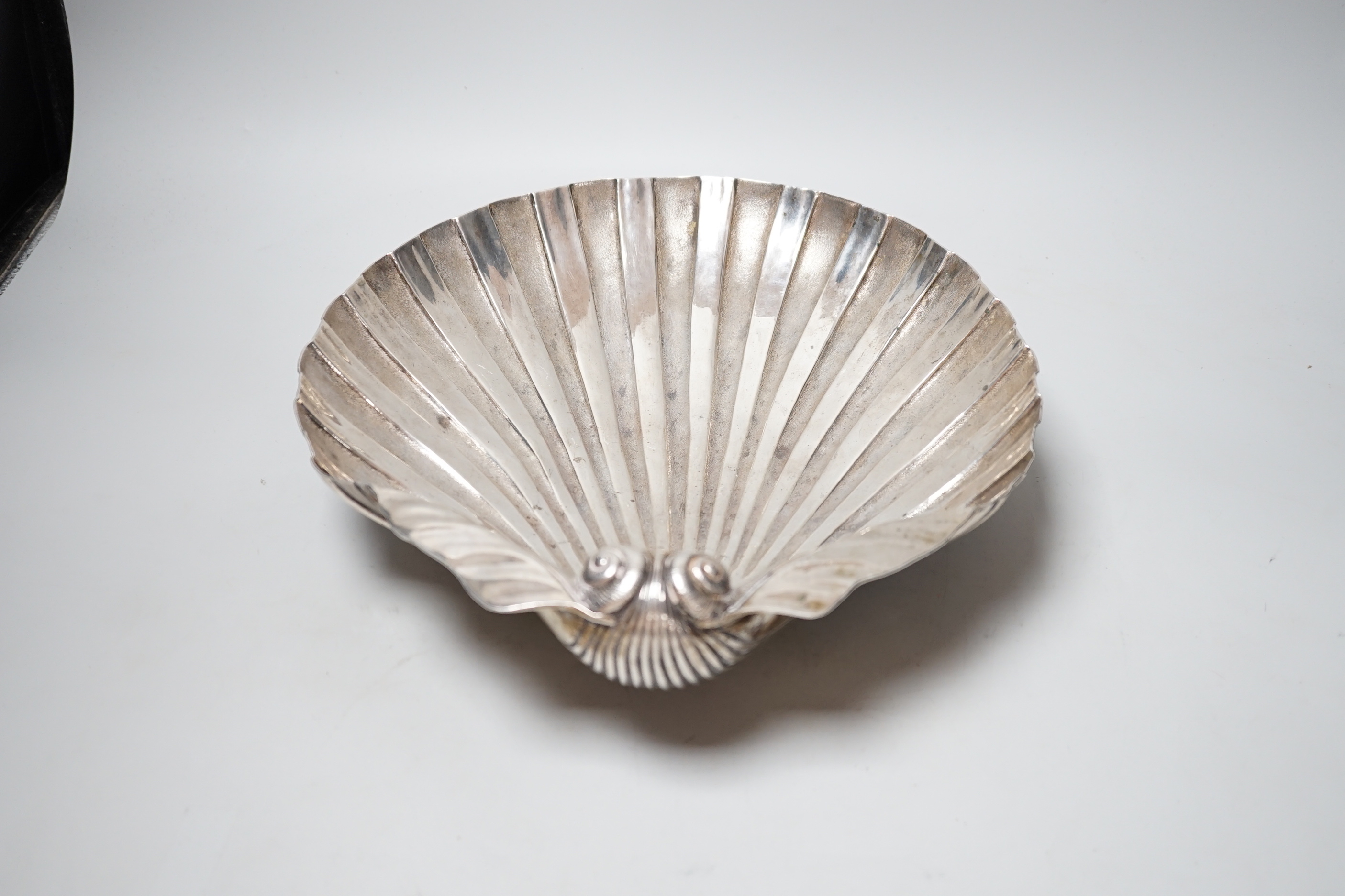 A 19th century Austro-Hungarian with metal fruit bowl, modelled as a half shell, on three shell feet, 34.3cm, 34.4oz.